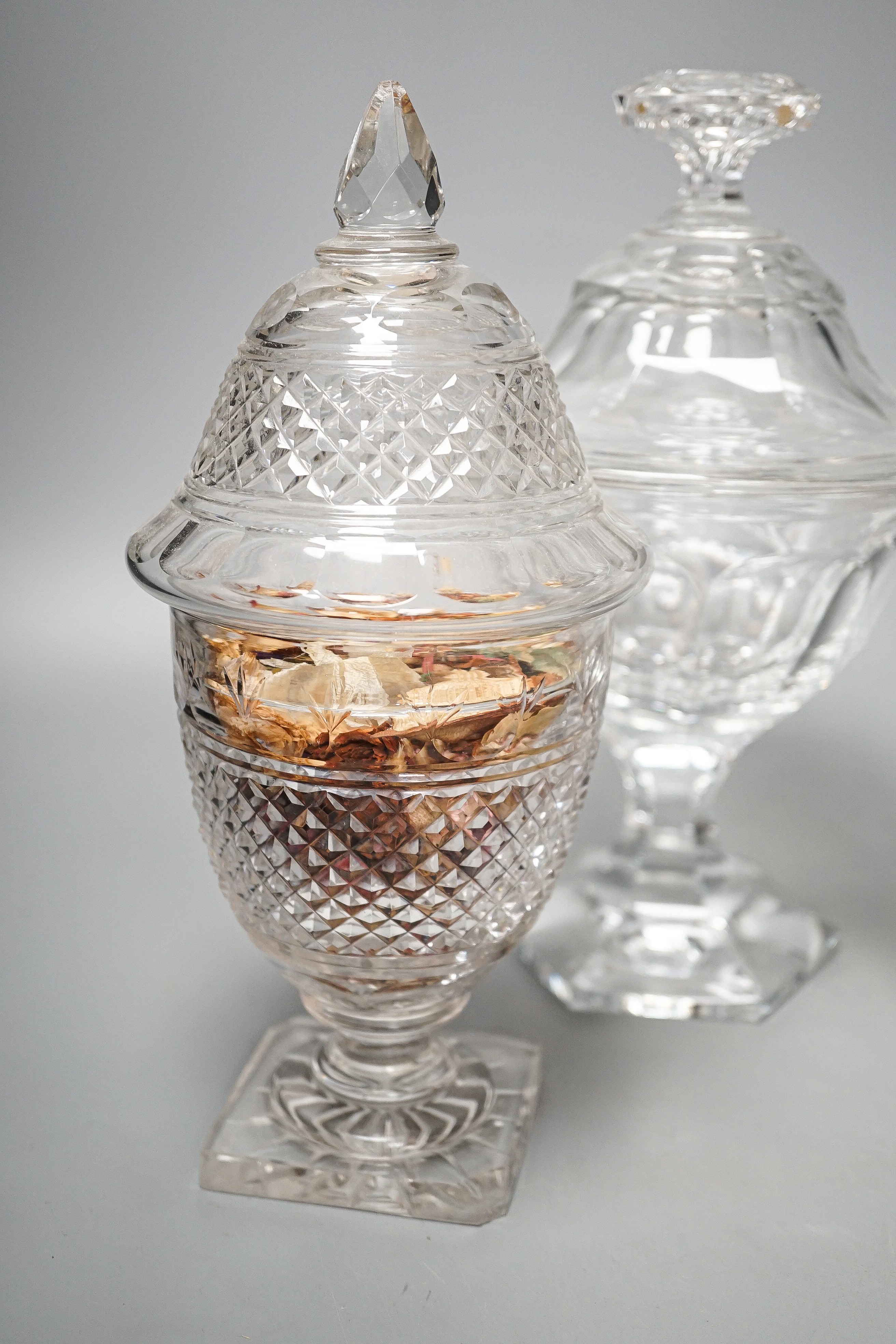 Two pairs of 19th century cut glass glass sweetmeat jars and covers (one a.f.), tallest 25 cms high.